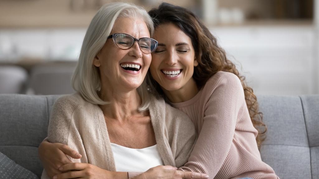 Happy excited senior mom and adult daughter