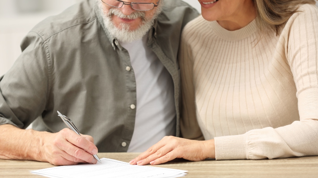 Senior couple signing Last Will