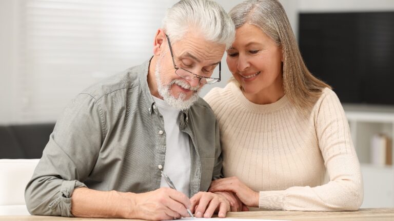Senior couple signing Last Will