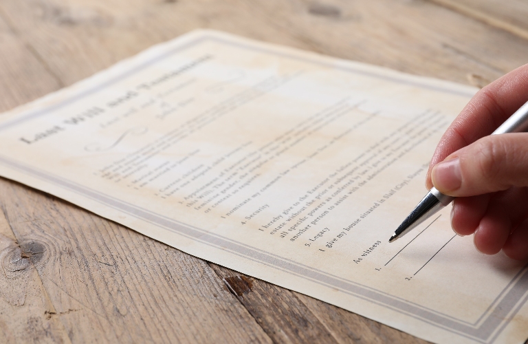 Woman signing Last Will